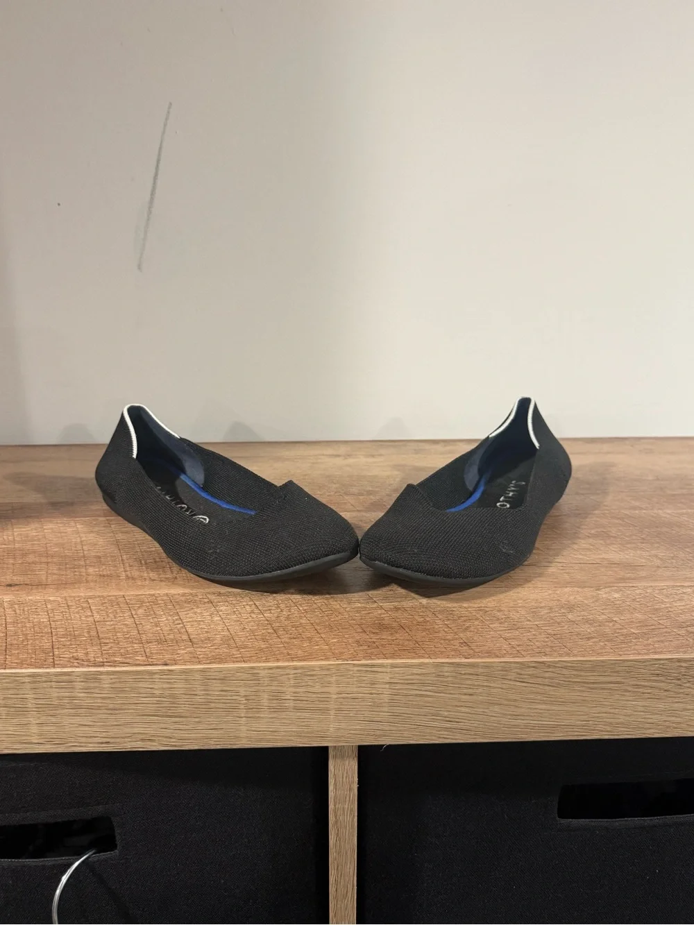Rothy's Black Slip-On Flats with White Trim